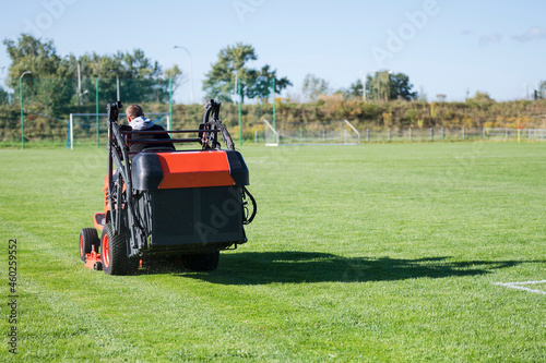 Mowing grass at the football field