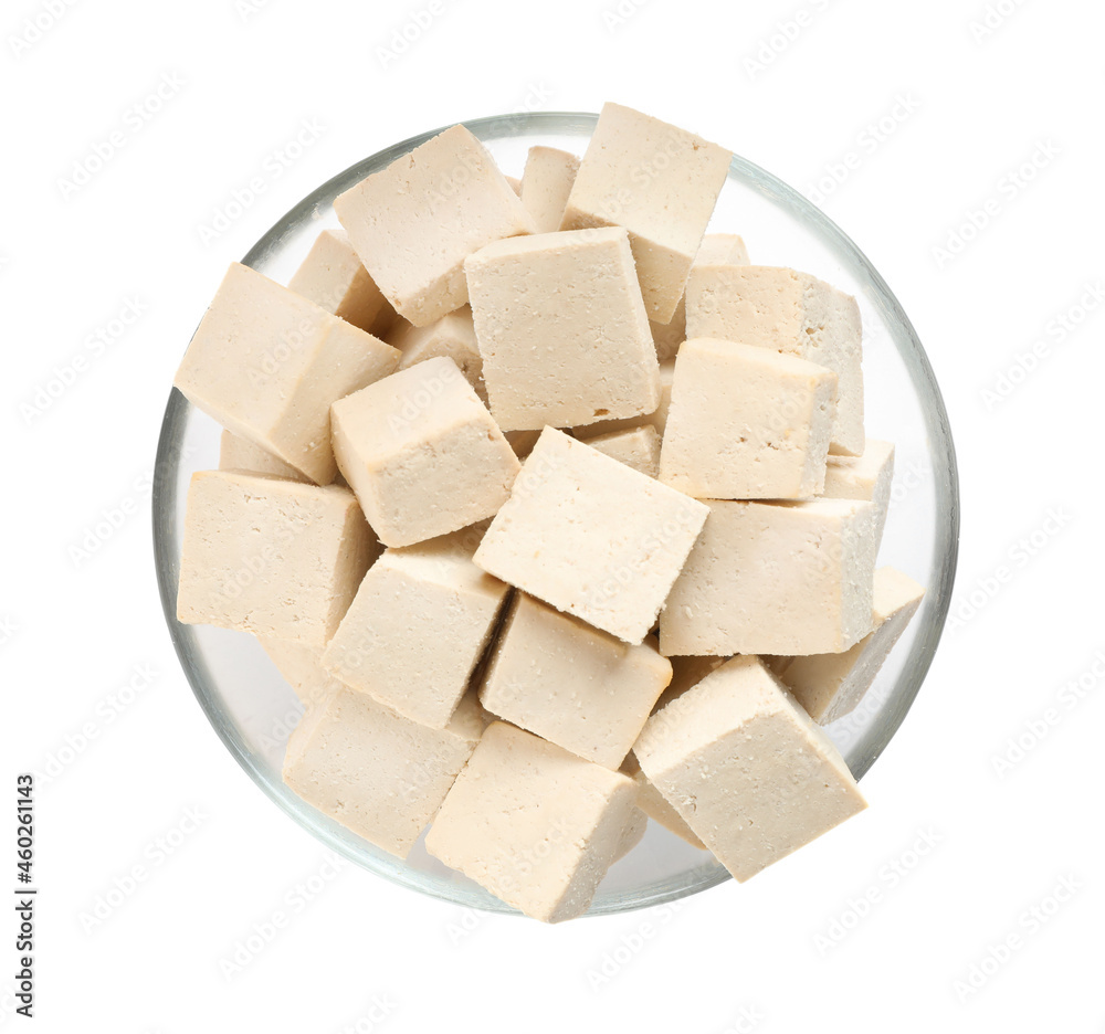 Glass bowl with delicious tofu isolated on white, top view