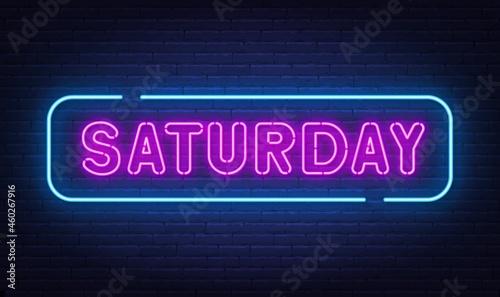Saturday neon sign on brick wall background.