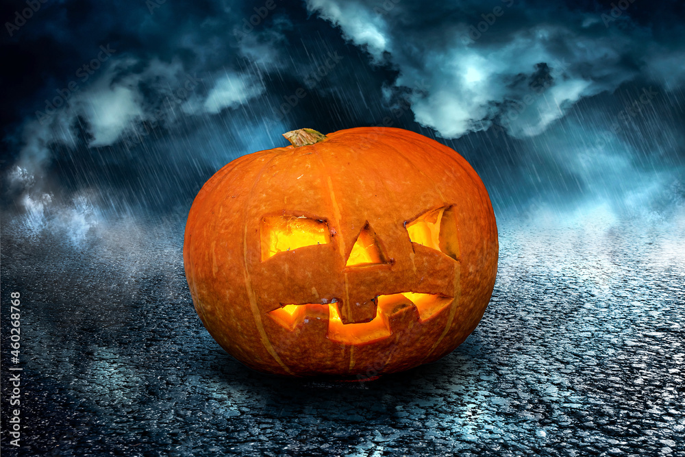 Fototapeta premium Halloween scary Night Pumpkin on dramatic dark creepy sky background. Halloween horror greeting card