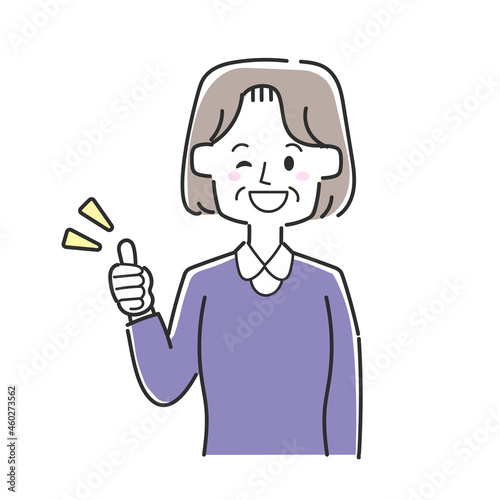 親指を立ててウインクをしているおばあさん