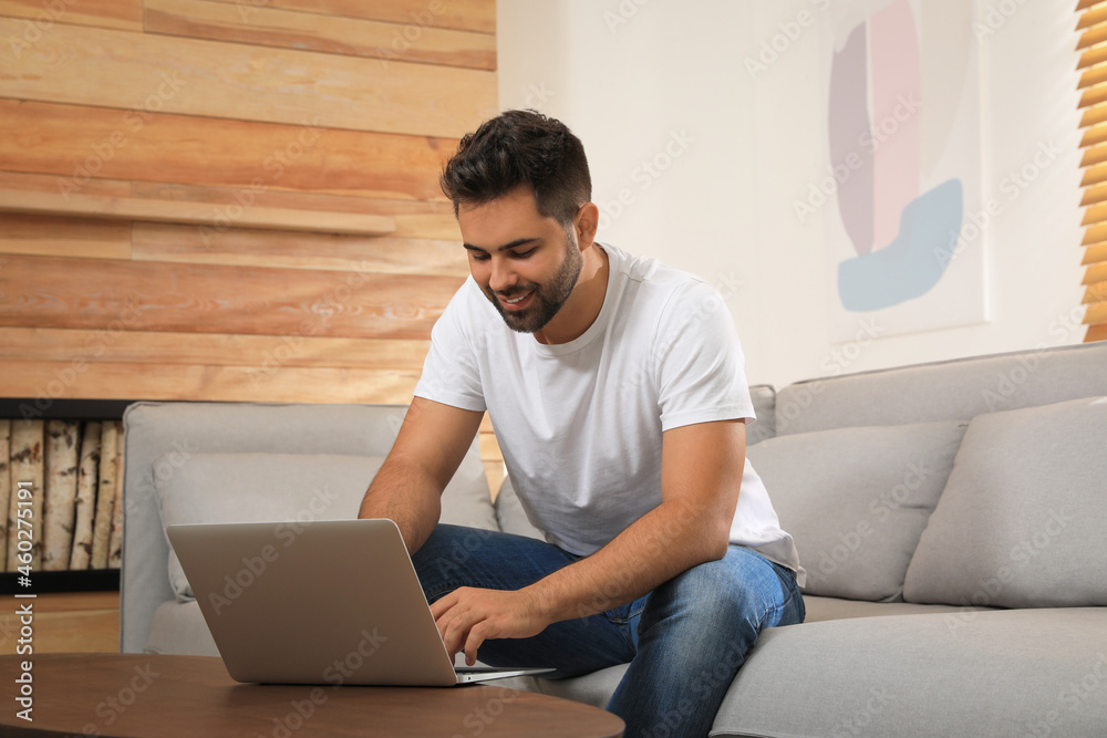 Man using laptop for online shopping at home Man using laptop for online shopping at home