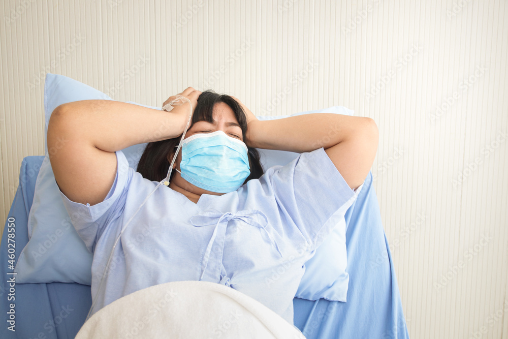 Asian obese female patient lying on the hospital bed She had a huge