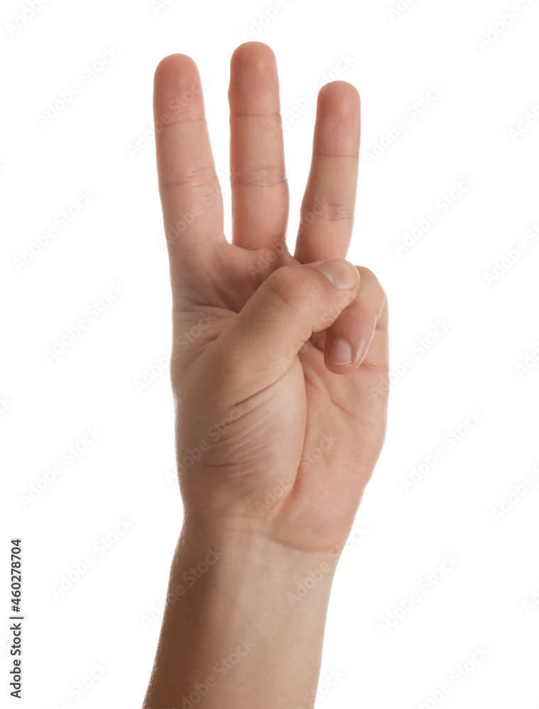 Teenage boy showing three fingers on white background, closeup Teenage boy showing three fingers on white background, closeup