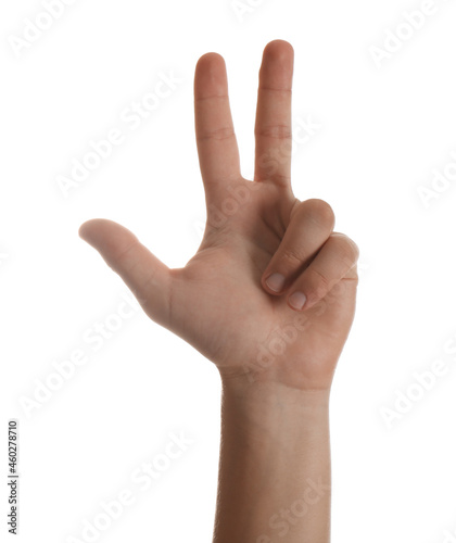 Teenage boy showing three fingers white background, closeup