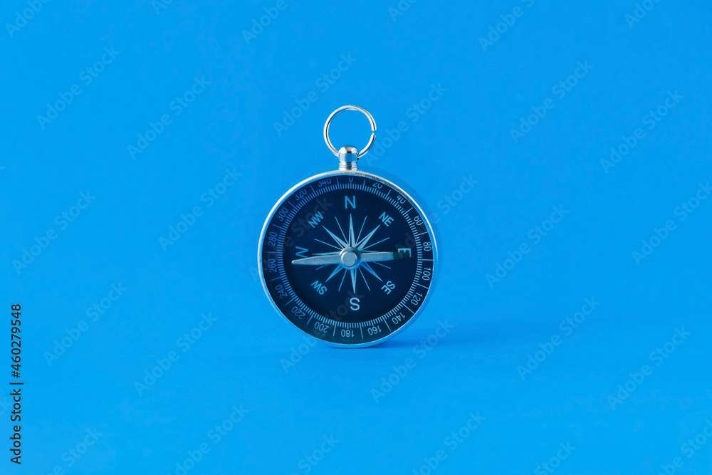 Compass isolated on a blue background
