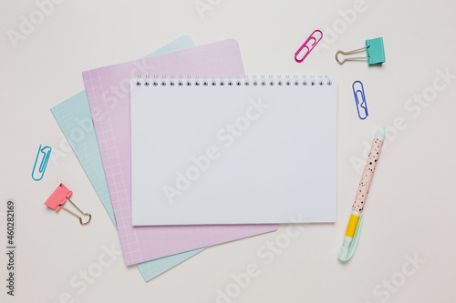 Notepad, exercise book and pen on the desk. Mock up in copy space office on white background. Back to school