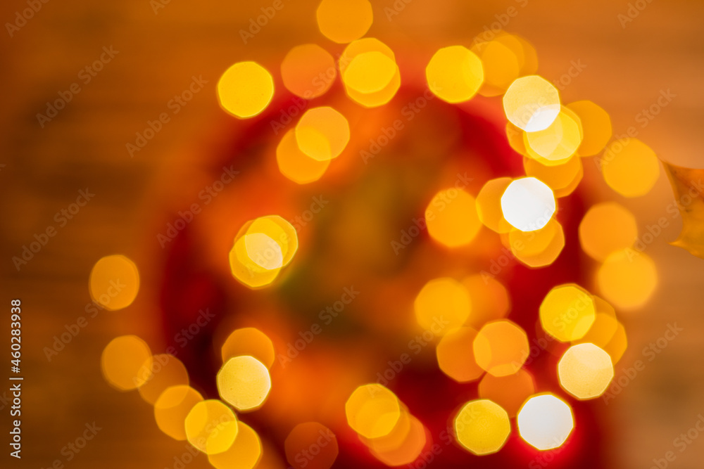 defocused garland for christmas and various holidays in red and orange defocused garland for christmas and various holidays in red and orange