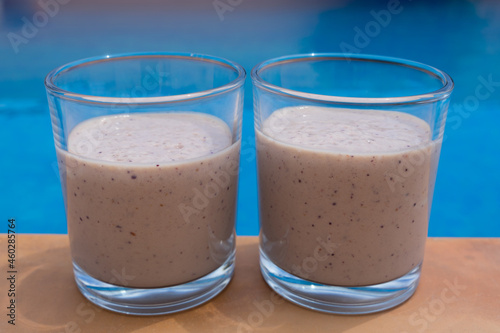 delicious fruit smoothies fresh drinks by the swimming pool food close-up for summer holidays