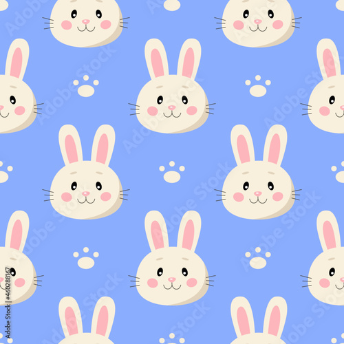 Seamless pattern with cute cartoon rabbits and paws isolated on blue background