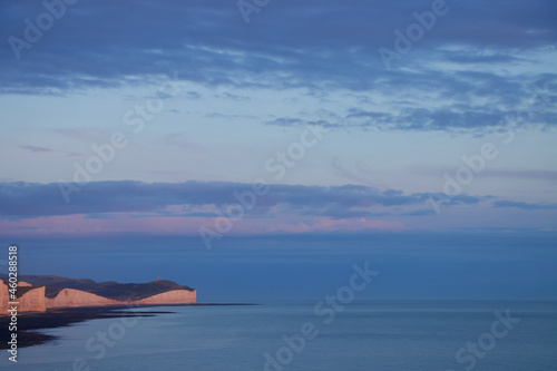 White chalk cliffs of Seven Sisters, South Downs, Eastbourne at sunset