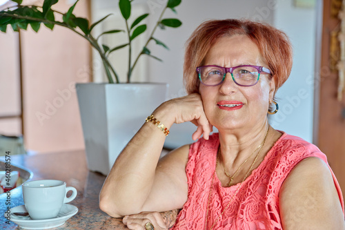 Portrait of senior smiling woman of 70s years old photo