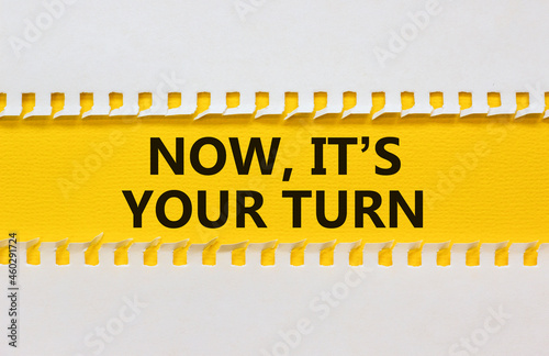 Your turn and support symbol. The words 'now it is your turn' on white and yellow paper. Beautiful yellow background. Business and support concept. Copy space.