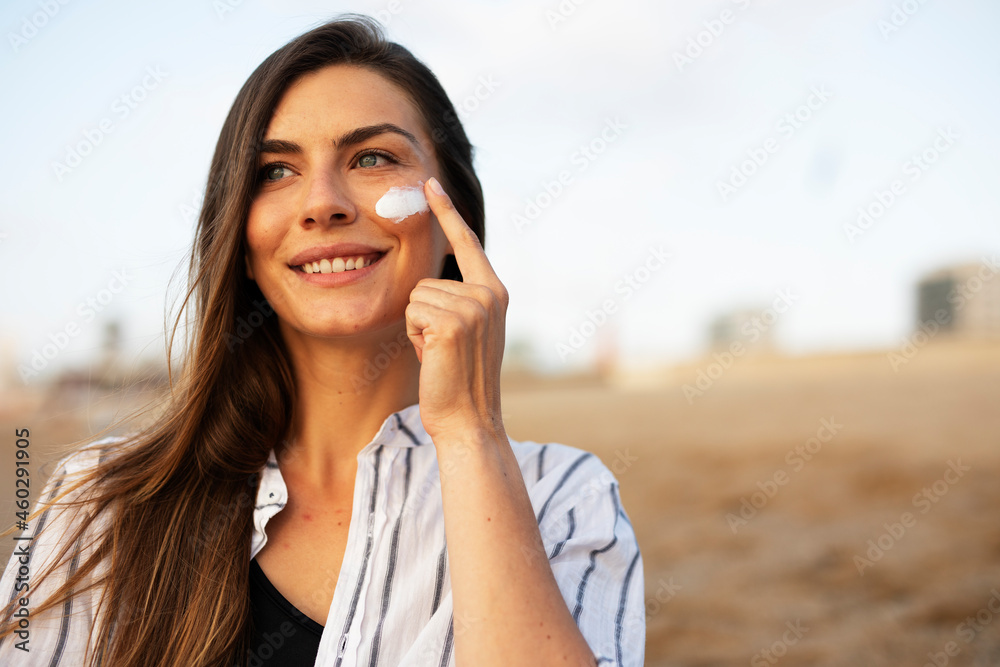 Woman using sunscreen cream. Beautiful girl with sun protection cream. Woman using sunscreen cream. Beautiful girl with sun protection cream.