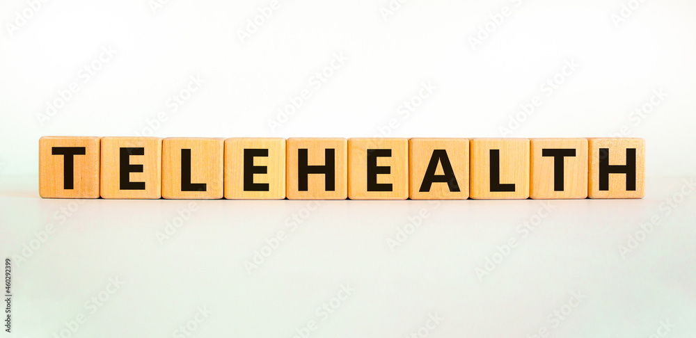 Time to telehealth symbol. Wooden cubes with the word 'telehealth'. Beautiful white table, white background, copy space. Business, medical and telehealth concept. Time to telehealth symbol. Wooden cubes with the word 'telehealth'. Beautiful white table, white background, copy space. Business, medical and telehealth concept.