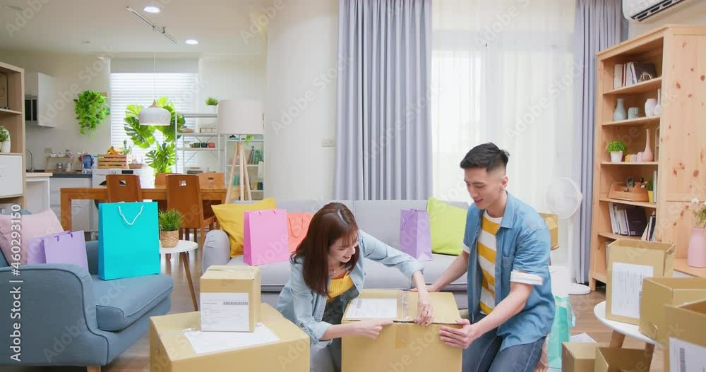couple open delivery boxes couple open delivery boxes