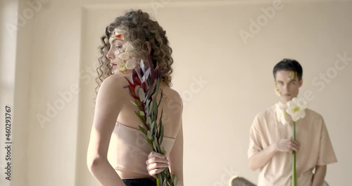 Tendet young couple with floral make up pose in studio photo