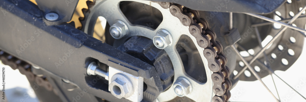 Detail of the rear chain of motorcycle with brake disc Detail of the rear chain of motorcycle with brake disc