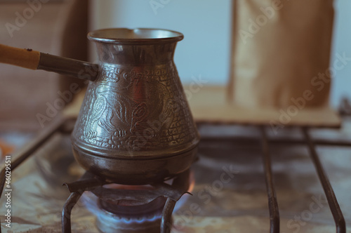 Turkish coffee pot on an open fire photo
