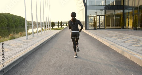 Wallpaper Mural Young black woman runner outdoor jogging at dawn Torontodigital.ca