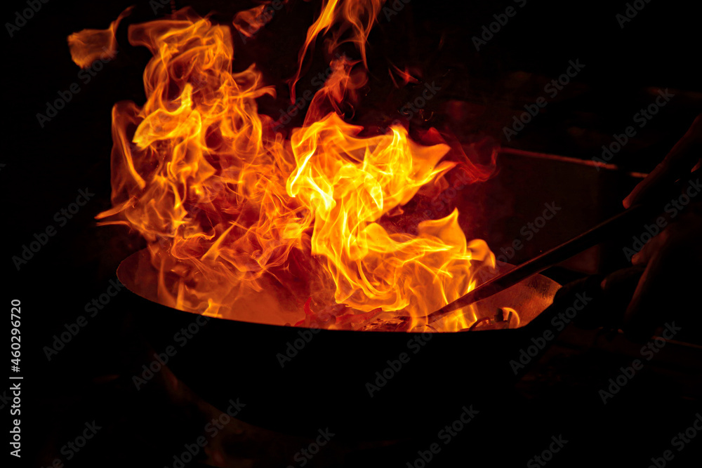 Oil catches fire while cooking and sparks are visible ภาพถ่ายสต็อก