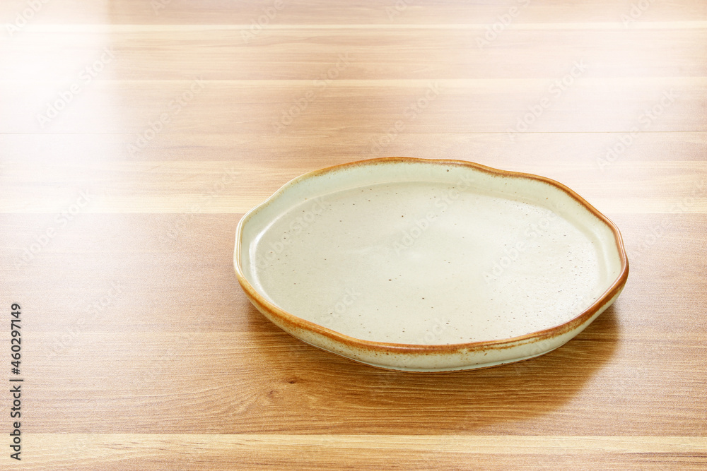 modern plate on wood table background modern plate on wood table background