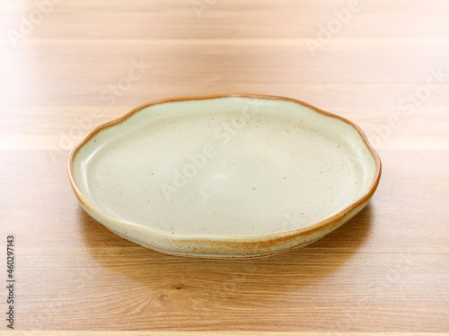 modern plate on wood table background