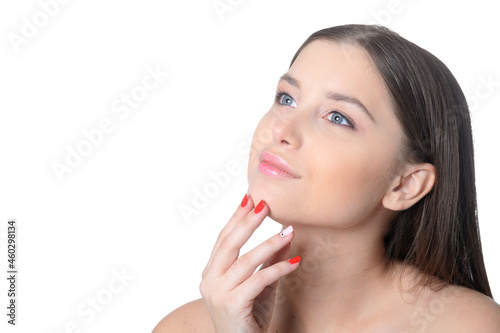 Portrait of beautiful young woman with perfect skin posing