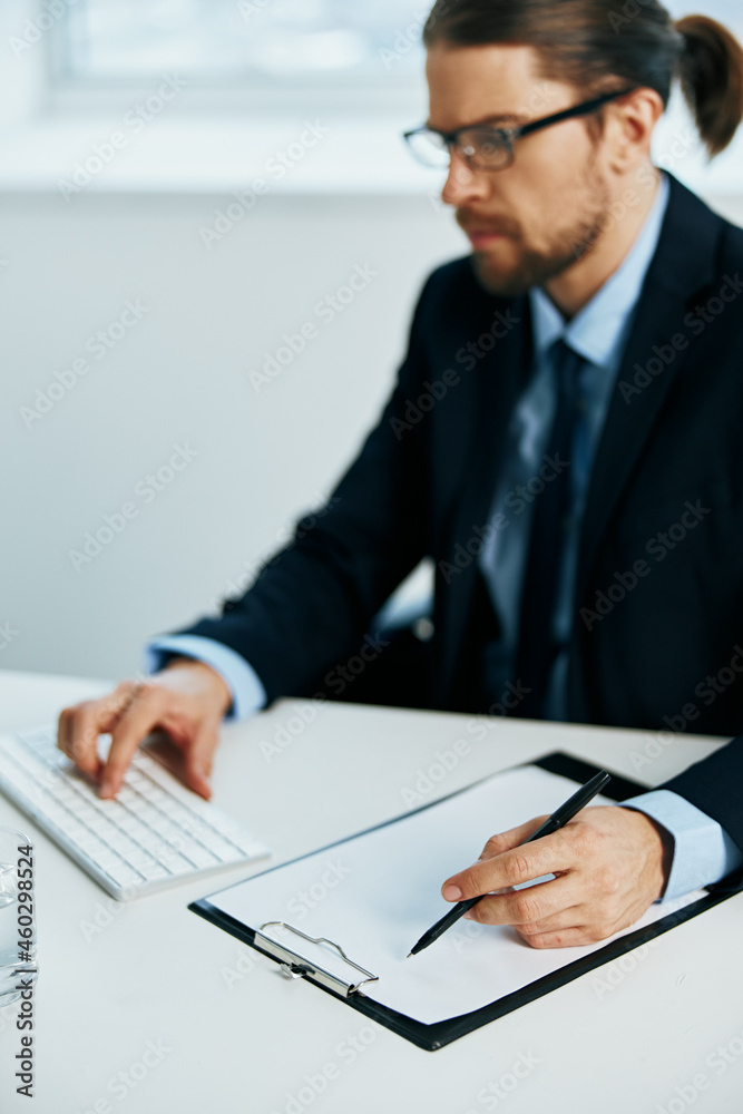 man in a suit at his desk manager work man in a suit at his desk manager work