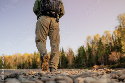 men walking on the pebble trail 