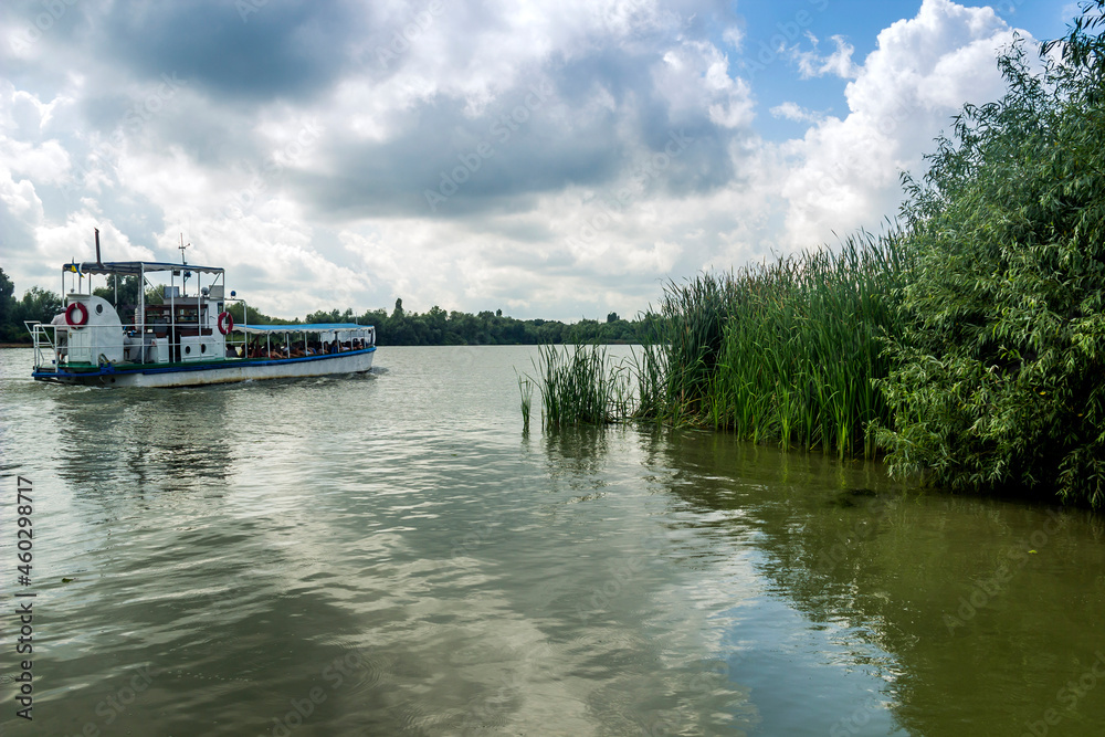 small tourist boat on Danube delta