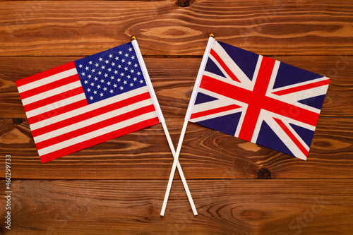 Flag of USA and flag of Great Britain crossed with each other. USA vs Great Britain. The image illustrates the relationship between countries. Photography for video news on TV and articles photo