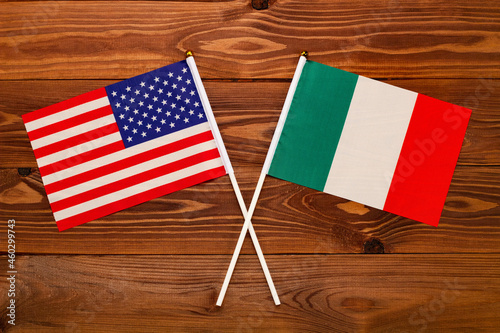 Flag of USA and flag of Italy crossed with each other. USA vs Italy EU. The image illustrates the relationship between countries. Photography for video news on TV and articles on the Internet