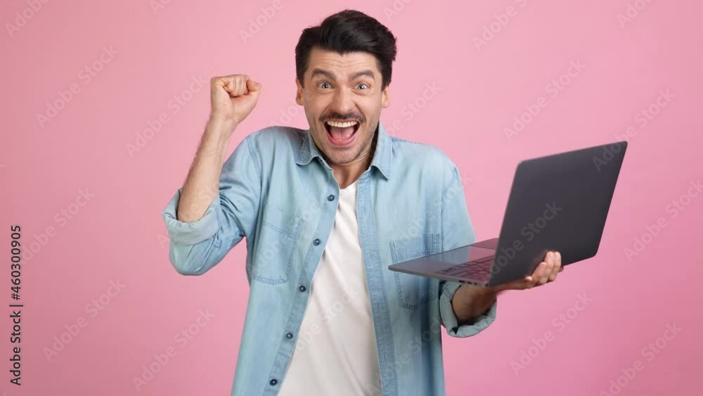 Positive freelancer programmer hold netbook rejoice fix difficult bug