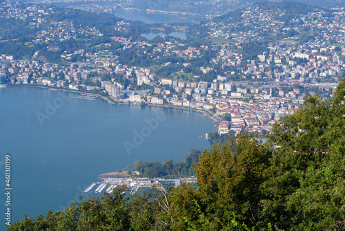 Aerial view of bay of Lake Lugano on a sunny late summer morning. Photo taken September 11th, 2021, Lugano, Switzerland.