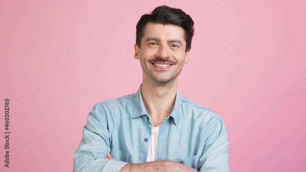 Self-assured business man crossed hands toothy white smile Self-assured business man crossed hands toothy white smile
