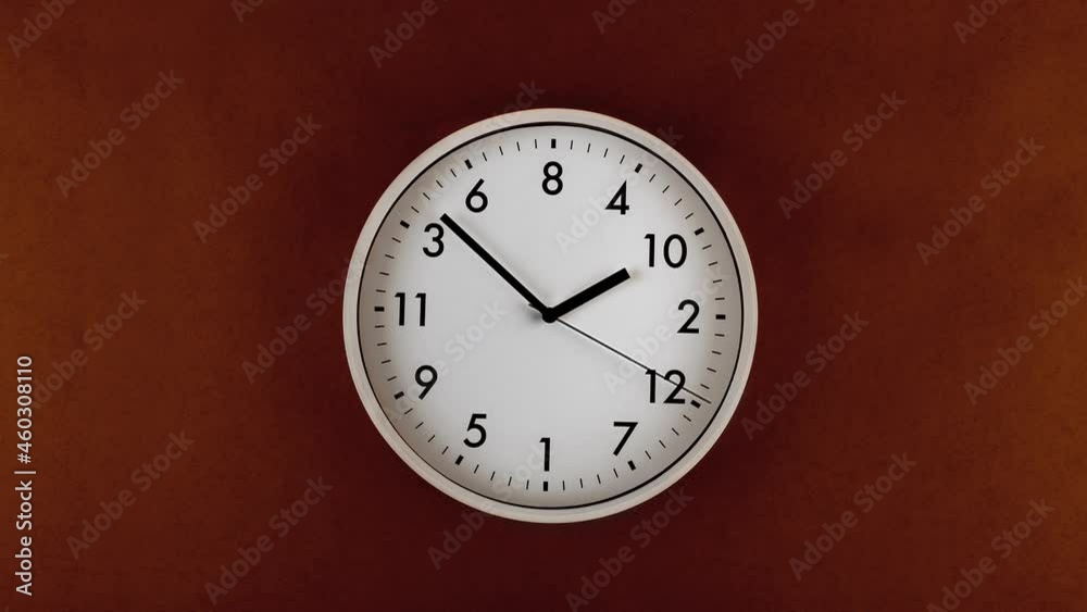 Clock with moving arrow hanging on wall Clock with moving arrow hanging on wall