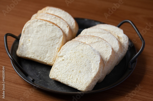 brown buttered bread on wooden background