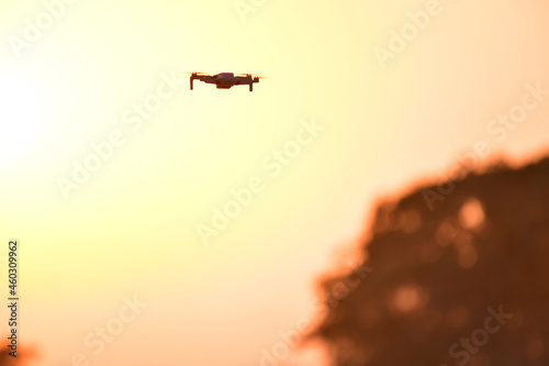Silhouette Drone flying on national park by sunrise