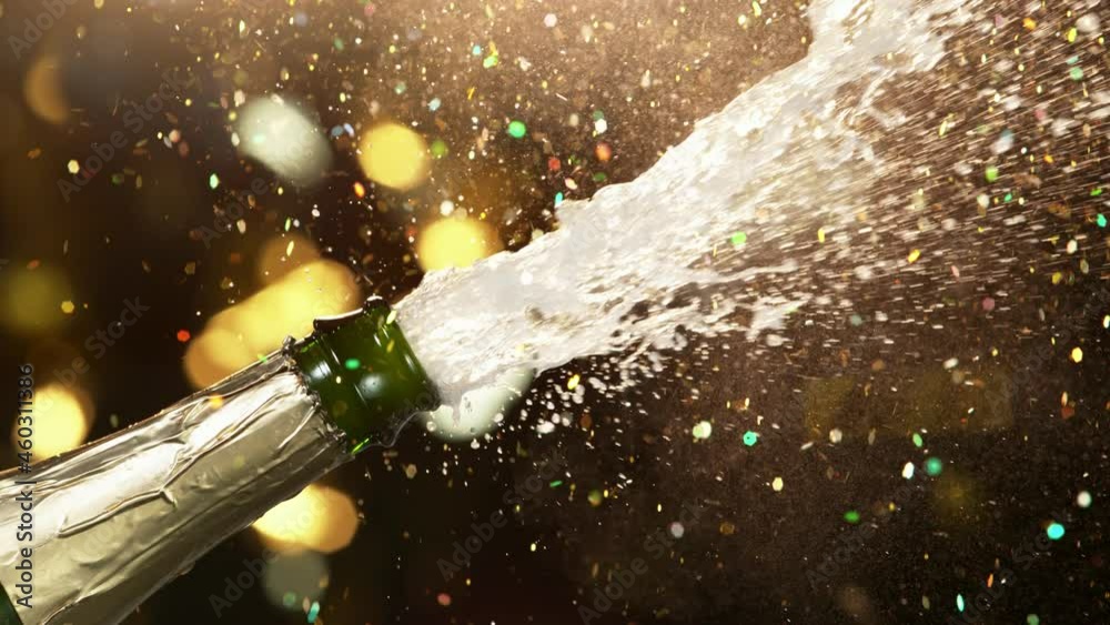 Super slow motion of Champagne explosion with glittering particles. Filmed on high speed cinema camera, 1000fps