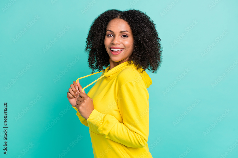 Photo portrait woman laughing wearing yellow clothes isolated vivid turquoise color background Photo portrait woman laughing wearing yellow clothes isolated vivid turquoise color background