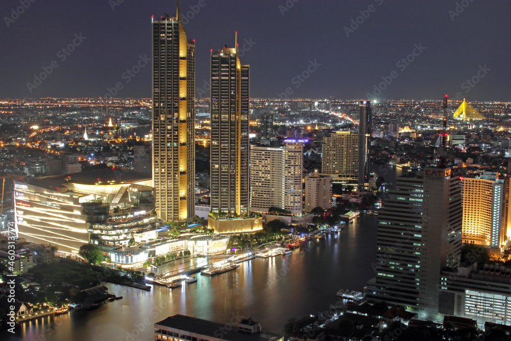 Fototapeta premium The Cityscape, the Skyscraper and the Chao Phraya River of Bangkok Thailand in the Night