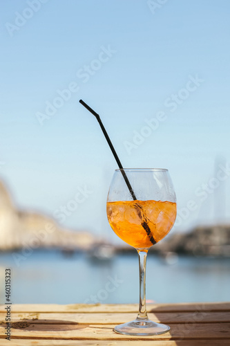 Aperol cocktail by the sea