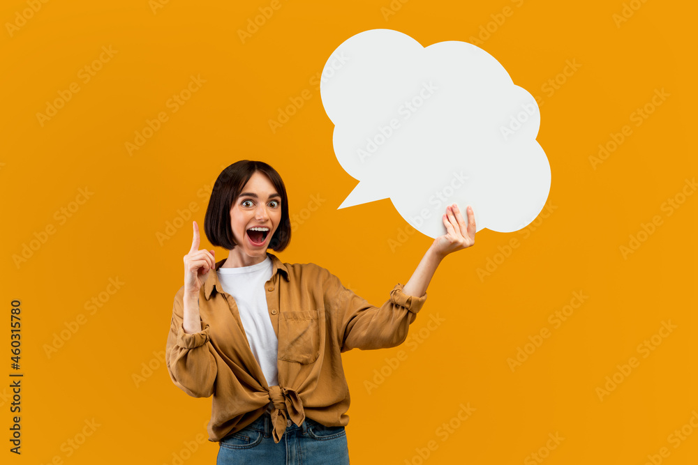 Wow idea concept. Surprised woman holding blank speech bubble and finger up, space with mockup for ad design Wow idea concept. Surprised woman holding blank speech bubble and finger up, space with mockup for ad design
