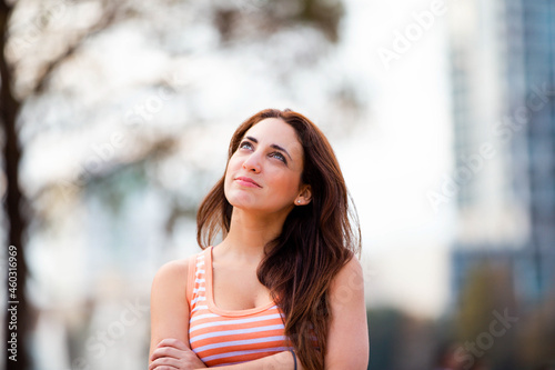 portrait of a woman looking up thinking 