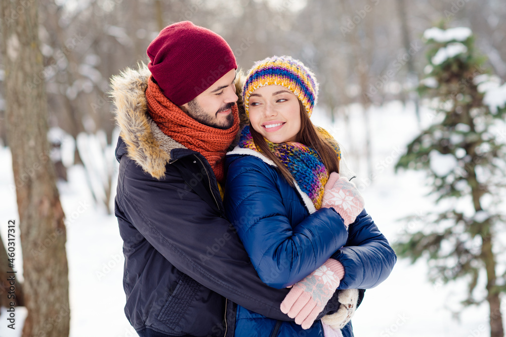 Profile portrait of two persons handsome guy hugging pretty lady look each other harmony great day outdoors Profile portrait of two persons handsome guy hugging pretty lady look each other harmony great day outdoors