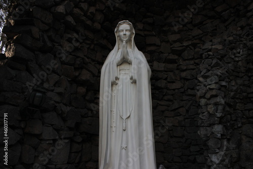 white statue in the catholic church garden