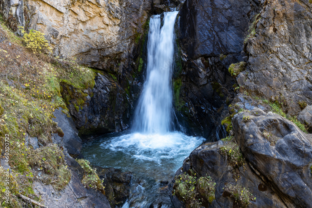 Fototapeta premium Kairak Waterfall is 55-meter (180 ft) high waterfall in Ile-Alatau National Park, Kazakhstan. The source of the river is located in the glaciers of the central part of the Zailiysky Alatau ridge.