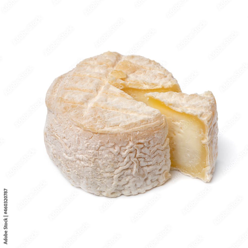 Single whole French small goat cheese with a piece isolated on white background Single whole French small goat cheese with a piece isolated on white background