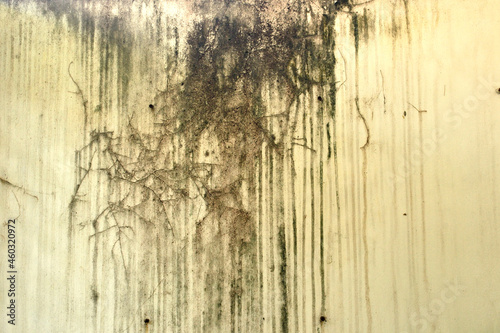 old stain marks of rain flow along with the wall surface.